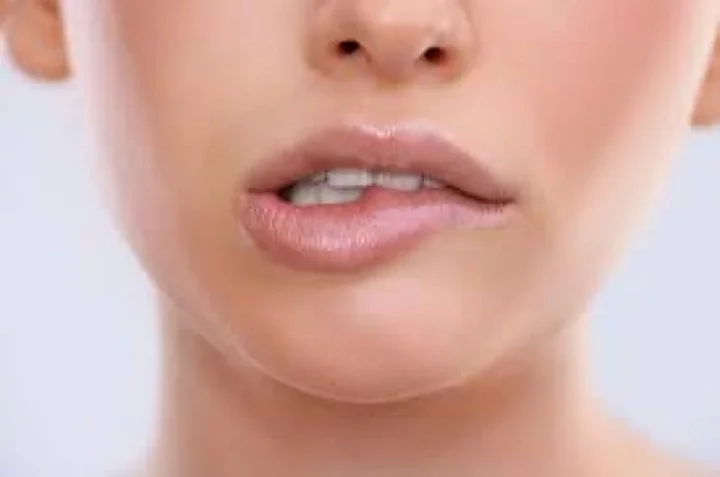 Image of a person biting their lip