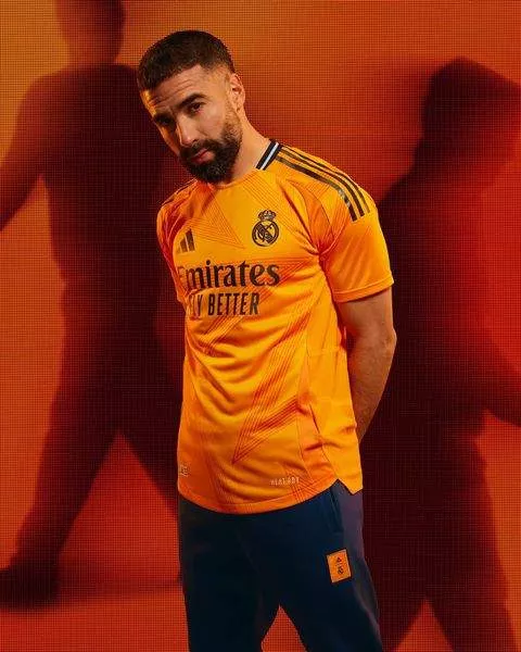 Inspired by Cristiano Ronaldo's La Decima triumph, check out the new 2024/25 Orange Real Madrid jersey modelled by Mbappe and Bellingham