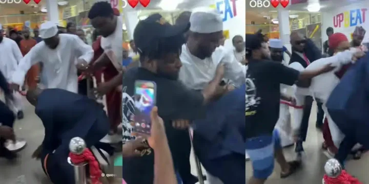 Moment overzealous fan nearly drags Davido to the ground