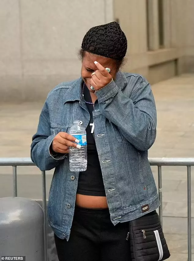 A Trump supporter cries outside the Manhattan courthouse after hearing the former president was found guilty by a jury of all 34 counts of falsifying business records