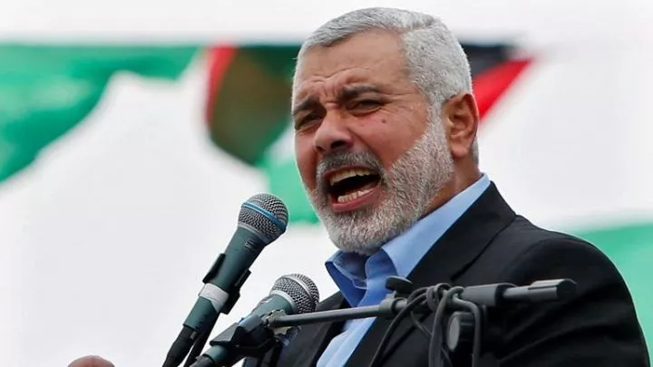 FILE PHOTO: Haniyeh talks to his supporters during a Hamas rally marking the anniversary of the death of its leaders killed by Israel, in Gaza<br />