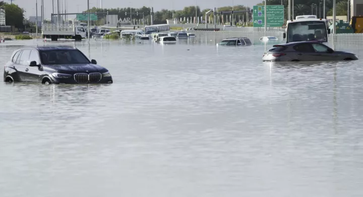 What's causing the rain and flood in Dubai? [AP]