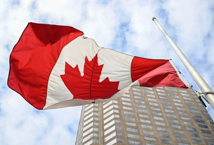 A Canadian flag in Montreal, Quebec, Canada, on Friday, March 15, 2024. Following a meeting, Prime Minister Trudeau said that he would not give more power to Quebec on immigration, The Montreal Gazette reports.  