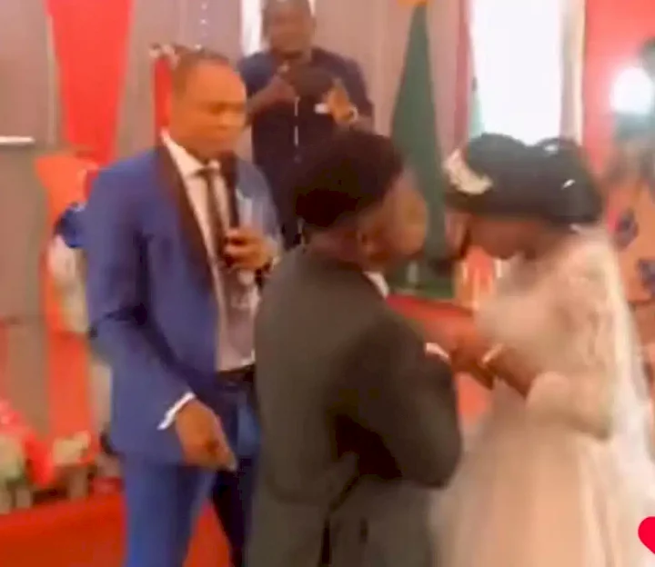 Groom sparks outrage after slapping bride instead of kissing her at the alter (Video)