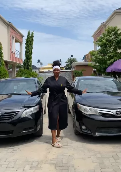 Skit-maker, Ashmusy gifts cars to her loyal workers (Video)