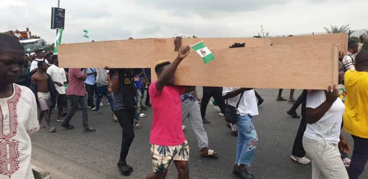 #EndSARS memorial: Falz, Mr Macaroni join youths as they march with dummy coffins at Lekki Tollgate (Photos/Video)