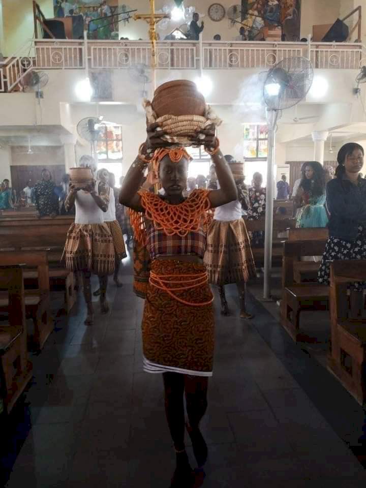 Reactions pour in as photos from a Catholic church in Abuja celebrating mass using African cultural items surface online