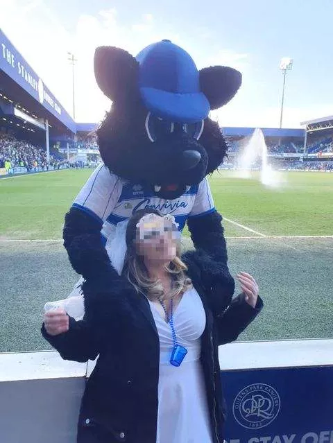 QPR mascot flirting with a female fan -- Getty