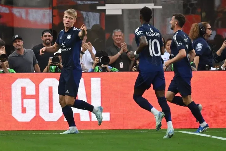 Manchester United's Danish forward #09 Rasmus Hojlund (L) reacts after scoring a goal during the pre-season club friendly football match between Manchester United FC and Arsenal FC at SoFi Stadium in Inglewood, California on July 27, 2024. (Photo by Patrick T. Fallon / AFP) (Photo by PATRICK T. FALLON/AFP via Getty Images)