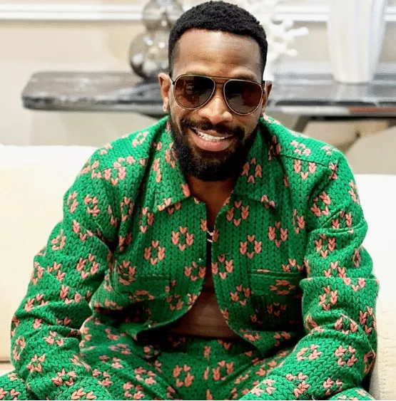 D'Banj dragged online for 'prostrating' to Pastor Jerry Eze during birthday visit