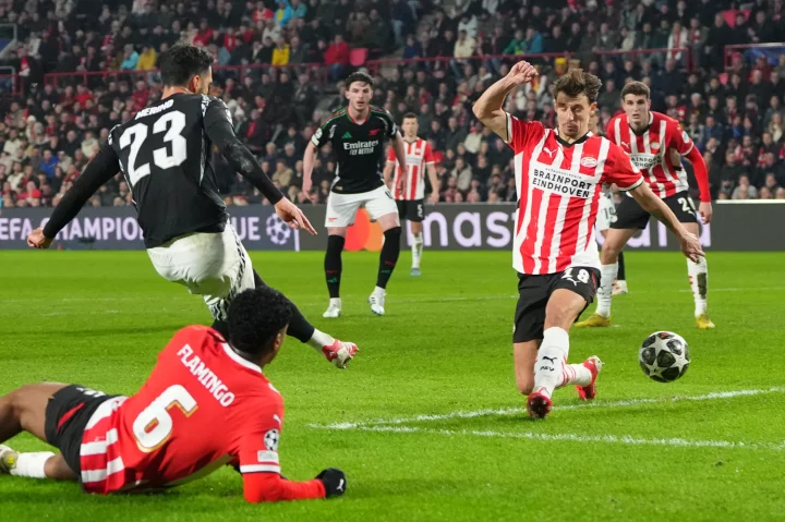 Mikel Merino scoring a goal during a soccer match.