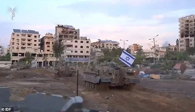 The tanks could be seen carrying Israel flags during the ceremony in Gaza City