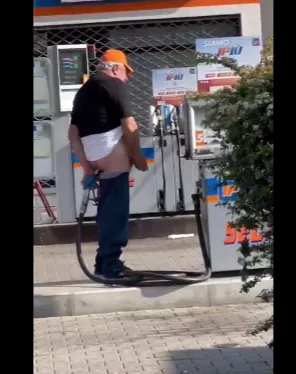 Man caught shoving the nozzle from a petrol pump up his bum while stroking his member at petrol station (+18 video)