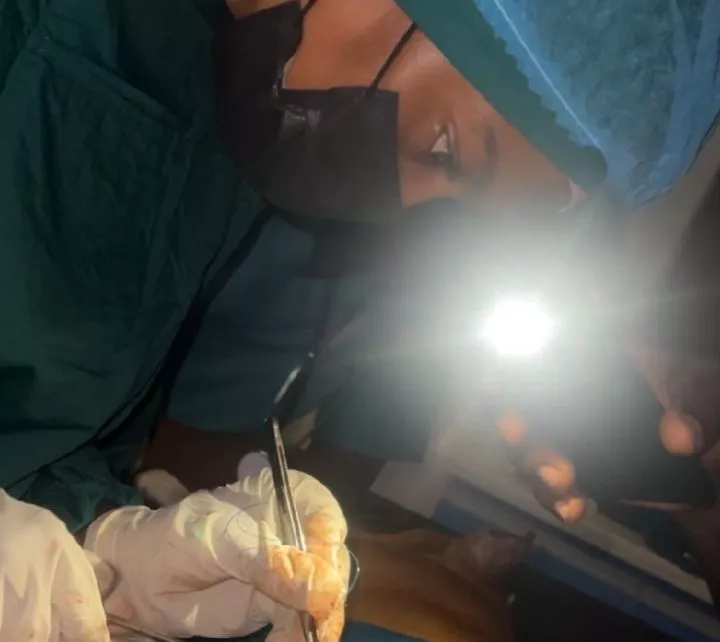 This Is Nigeria - Nigerian Assistant Surgeon Writes as She Performs Surgery with Torch Light This Is Nigeria - Nigerian Assistant Surgeon Writes as She Performs Surgery with Torch Light