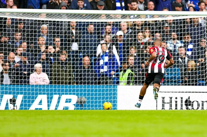 Bryan Mbeumo rolls the ball into the empty net