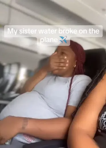 Moment pregnant woman's water breaks on Airplane