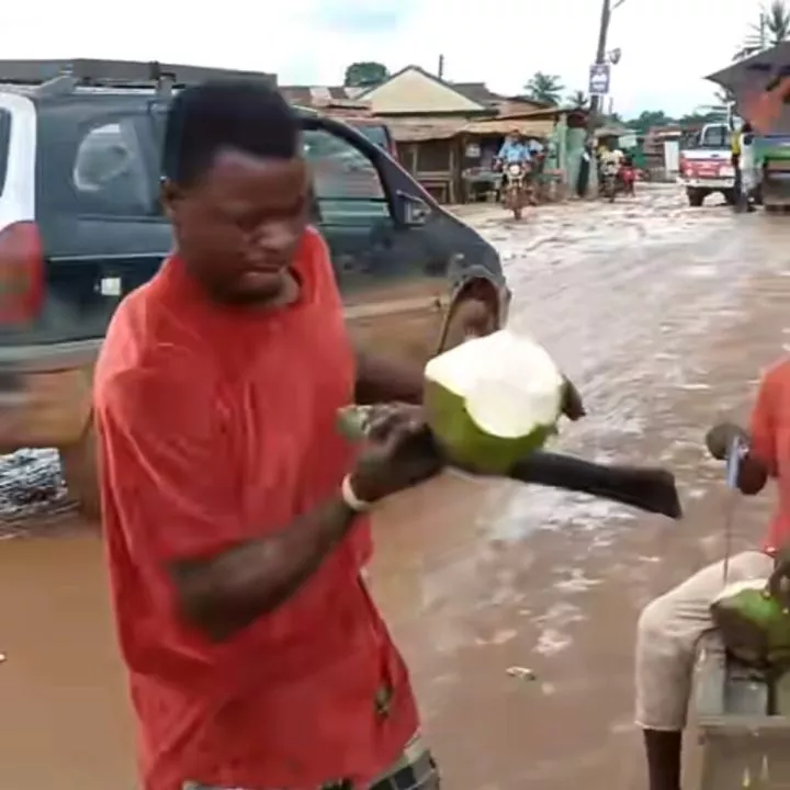 Nigerian man shows off rare talent as he cuts coconut on his head without looking