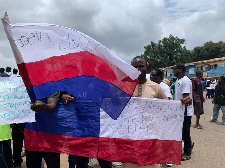 #EndBadGovernance Protesters Call for Help as Russian, Japanese Flags Spotted in Jos (Pictures)