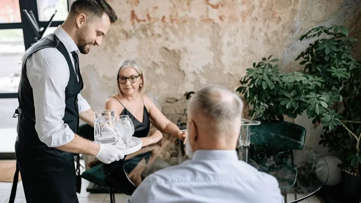 waiter takes couple's order