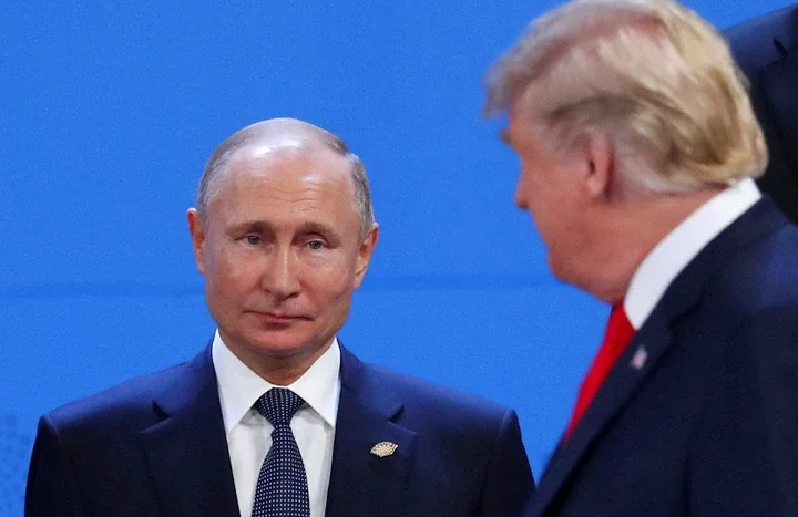 President Donald Trump, right, and Russia's President Vladimir Putin are seen during the G20 leaders summit in Buenos Aires, Argentina, on Nov. 30, 2018.