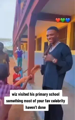 'Wetin Big Wiz dey talk?' - Reactions trail video of Wizkid speaking to pupils at his childhood school