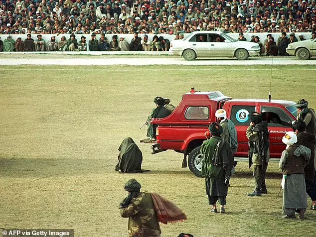 Taliban execute two murderers by machine-gunning them in front of thousands of spectators at football stadium