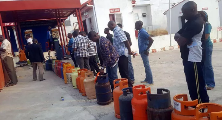 A cooking gas depot with customers in queue to refill their cylinders. [Punch]