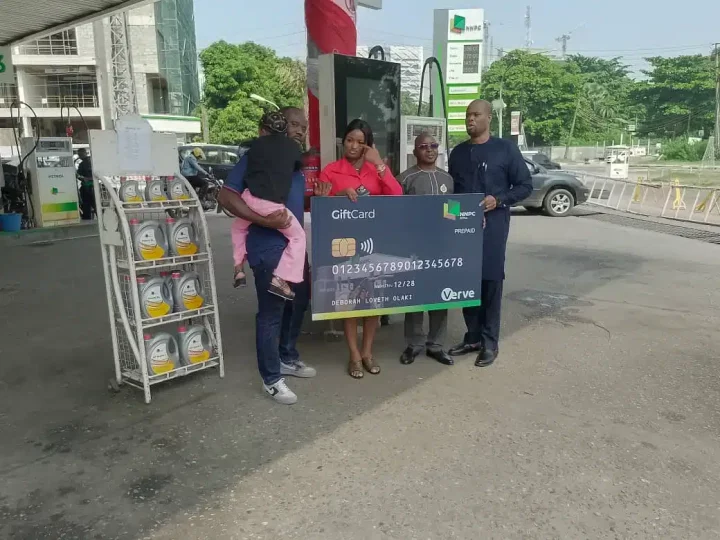 Mummy Zee and husband visit NNPC to receive their N200K fuel voucher