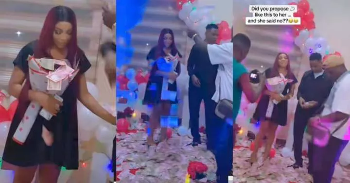"Which mouth she wan use talk No" - Man makes it rain money on girlfriend during marriage proposal