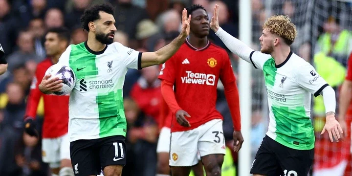 Liverpool's Mohamed Salah celebrates scoring their second goal with Harvey Elliott