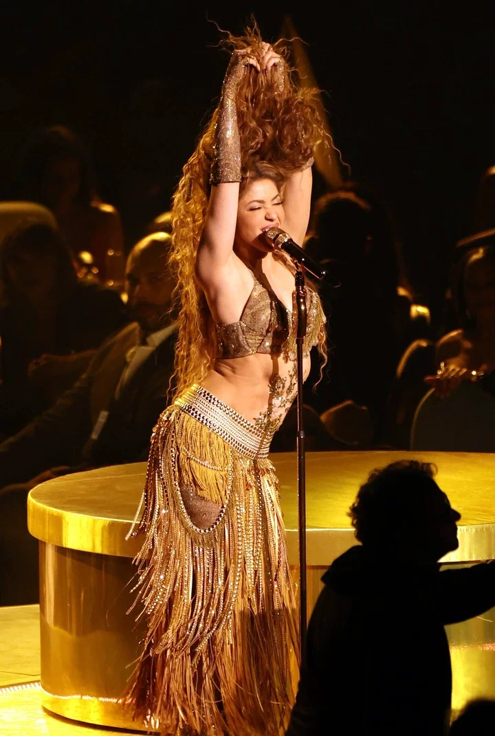 Shakira performing onstage at an awards show.