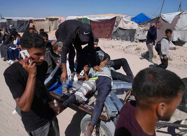 Nine women and children among 22 killed by Israeli strike on house in Gaza