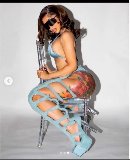 Cardi B showcases her ample cleavage and curves in blue bikini during sultry photo shoot