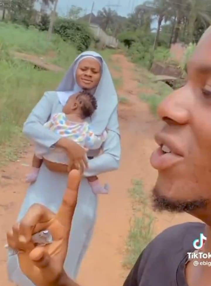 'God dey enjoy' - Man says as he shows off his beautiful sister who is a nun (Video)