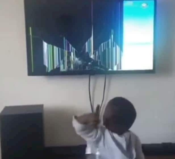 'This is the day Jesus will descend from heaven' - Dad fumes as he catches son smashing his plasma TV (Video)