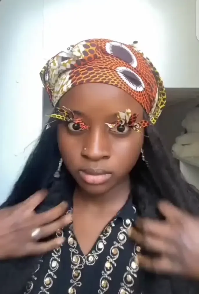 Lady ditches regular eyelashes for custom ones that matches native outfit