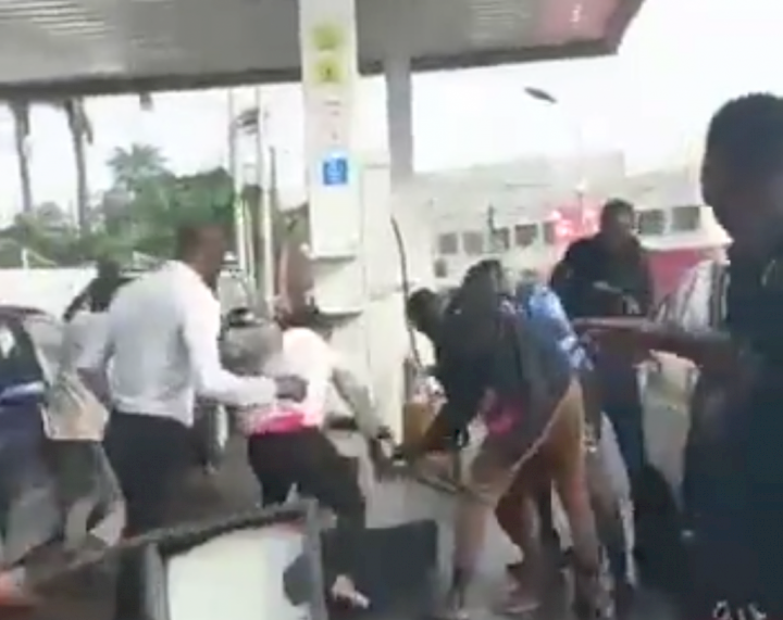 Naked woman sprays petrol, threatens to burn Lagos station (Video)
