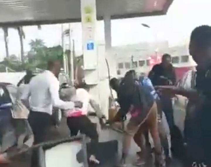 Viral video: Naked woman sprays petrol, threatens to burn Lagos station (Video)