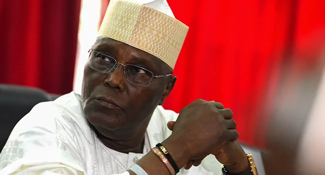 In this file photo taken on February 19, 2019 Candidate of the opposition Peoples Democratic Party (PDP) Atiku Abubakar (L) speaks with PDP Chairman of Board of Trustees Walid Jibrin as they attend an emergency National Executive Committee party meeting in Abuja ahead of rescheduled general elections. Pius Utomi EKPEI / AFP