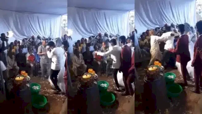 Chaos as groom fights man for spraying him money at his wedding (Video)
