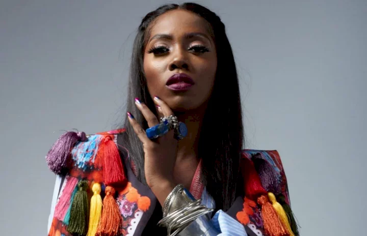 Tiwa Savage reacts as fan tattoos name on chest