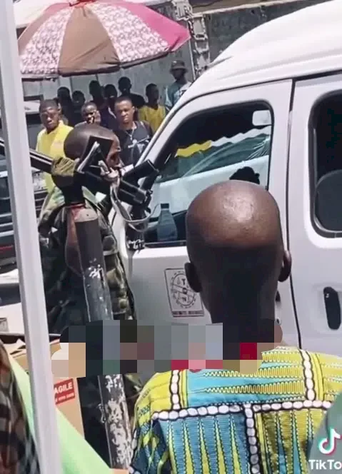 Soldier alleged to be drunk spotted stopping cars and collecting money while threatening occupants (Video)