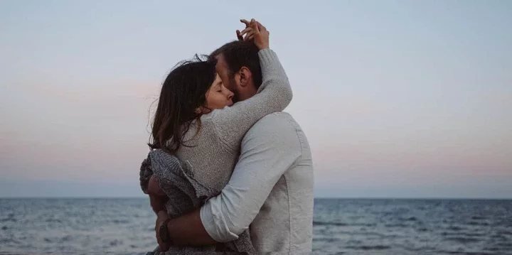 Couple deeply embracing on the beach