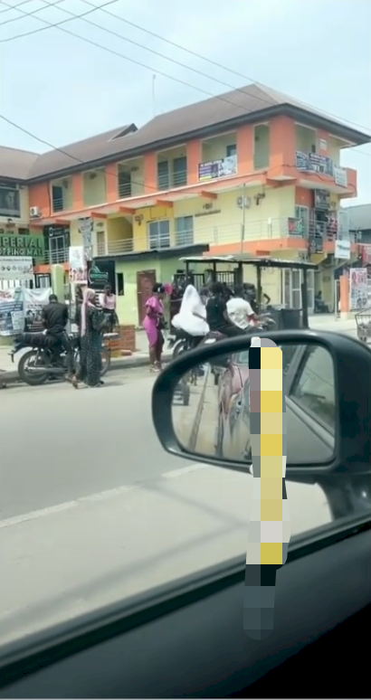 'Rugged lady' - Reactions as bride is forced to use bike to church due to Lagos traffic (Video)