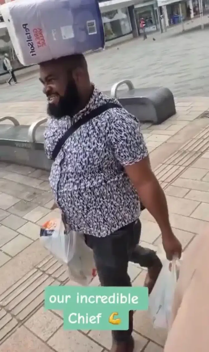 'Look at your chief' - Wife gushes as Nigerian husband carries load on his head abroad (Video)
