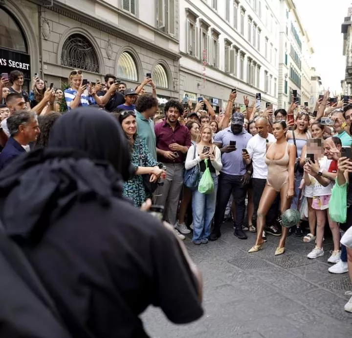 Kanye West and Bianca Censori cause a frenzy in Florence as rapper directs his wife to pose in front of excited locals (photos)