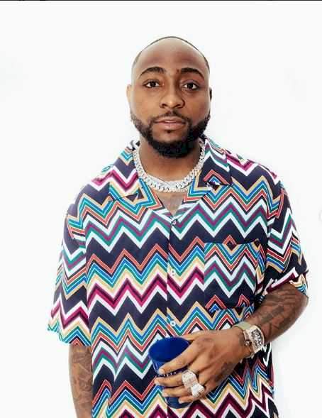 "Nah OBO monkey be this" - Reactions as man inks Davido's face on his chest