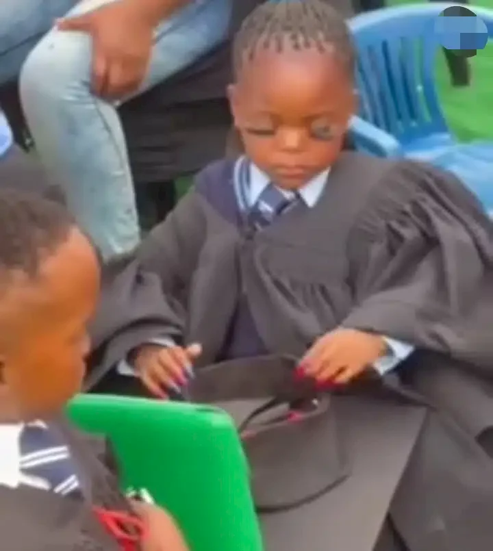 Reactions trail video of little girl with fake eyelashes and fixed nails at graduation