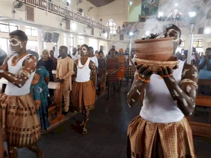 Reactions pour in as photos from a Catholic church in Abuja celebrating mass using African cultural items surface online