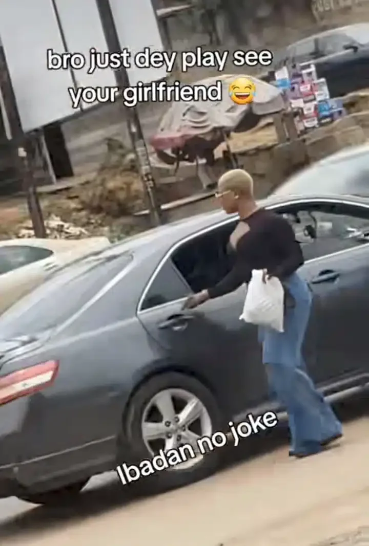 'Girls get mind' - Reactions trail viral video of lady descending moving bike to board flashy car by roadside